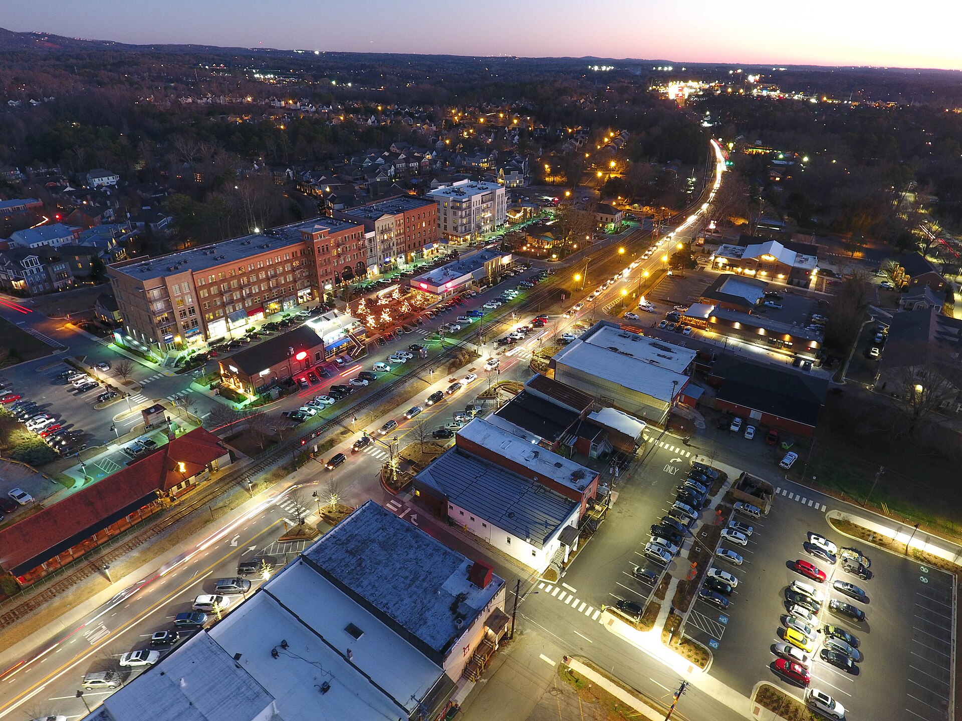 An evening aerial view of downtown Woodstock
